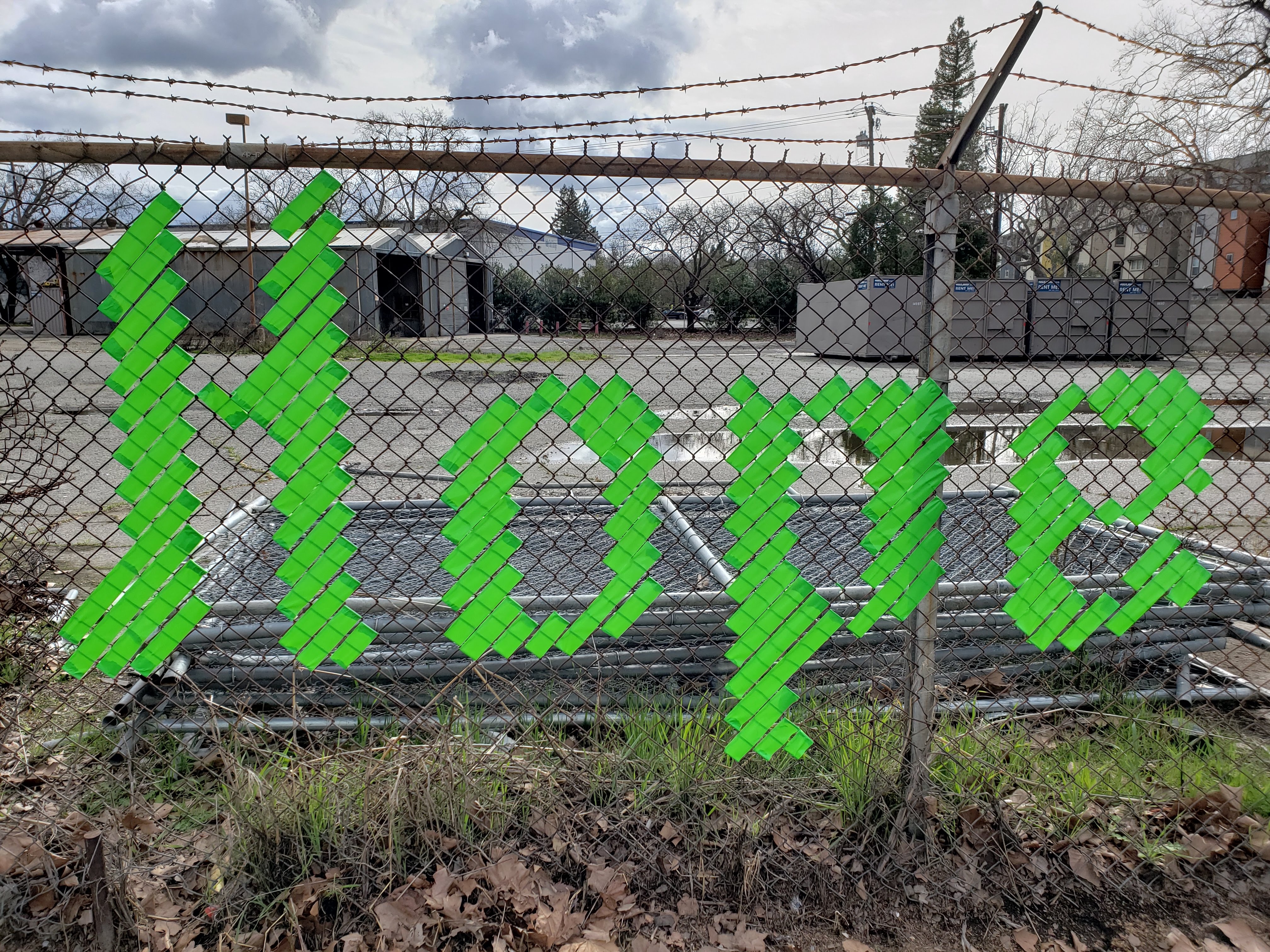 Hope spelled out on fence in lime green